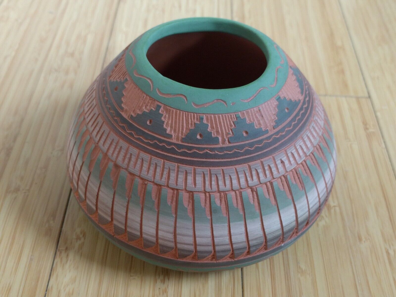 Handcrafted native American motive pottery sculpted terracotta vase