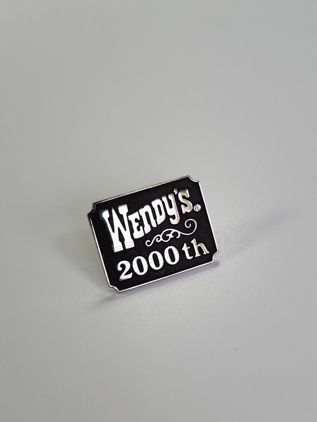 Wendy\'s Restaurant Lapel Pin 2000th Black & Silver Colors