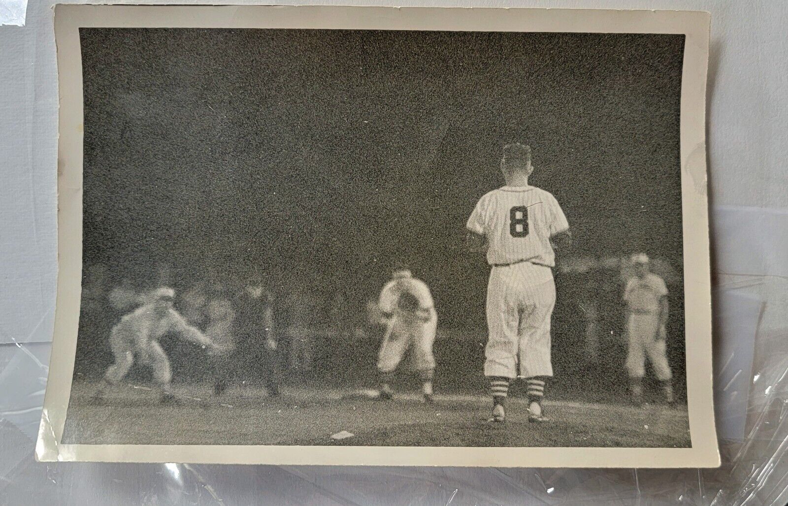 (1) Original night photo of NYC Yankee team players one wearing uniform #8