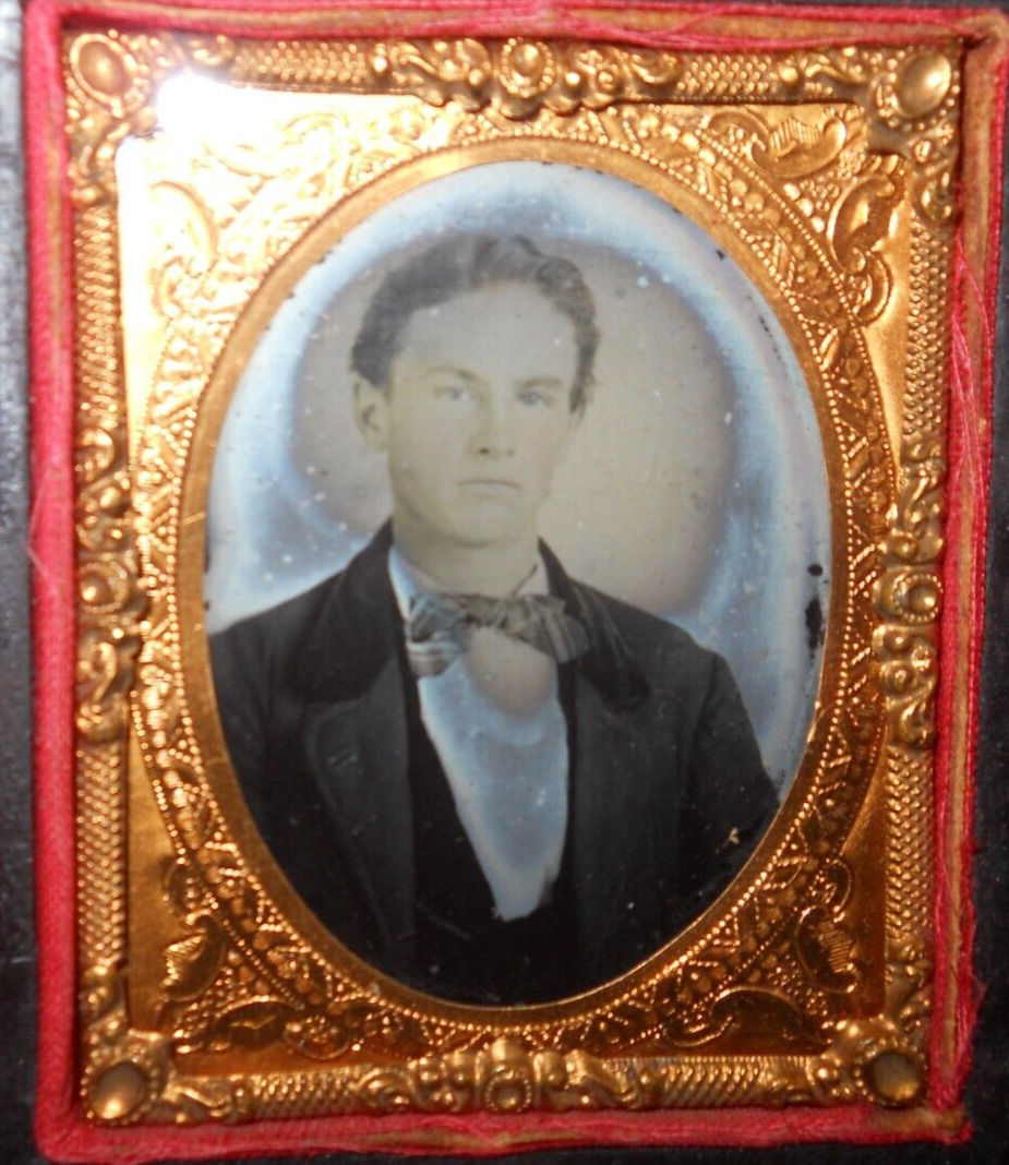 1/9th Size Ruby Ambrotype of young man in half case