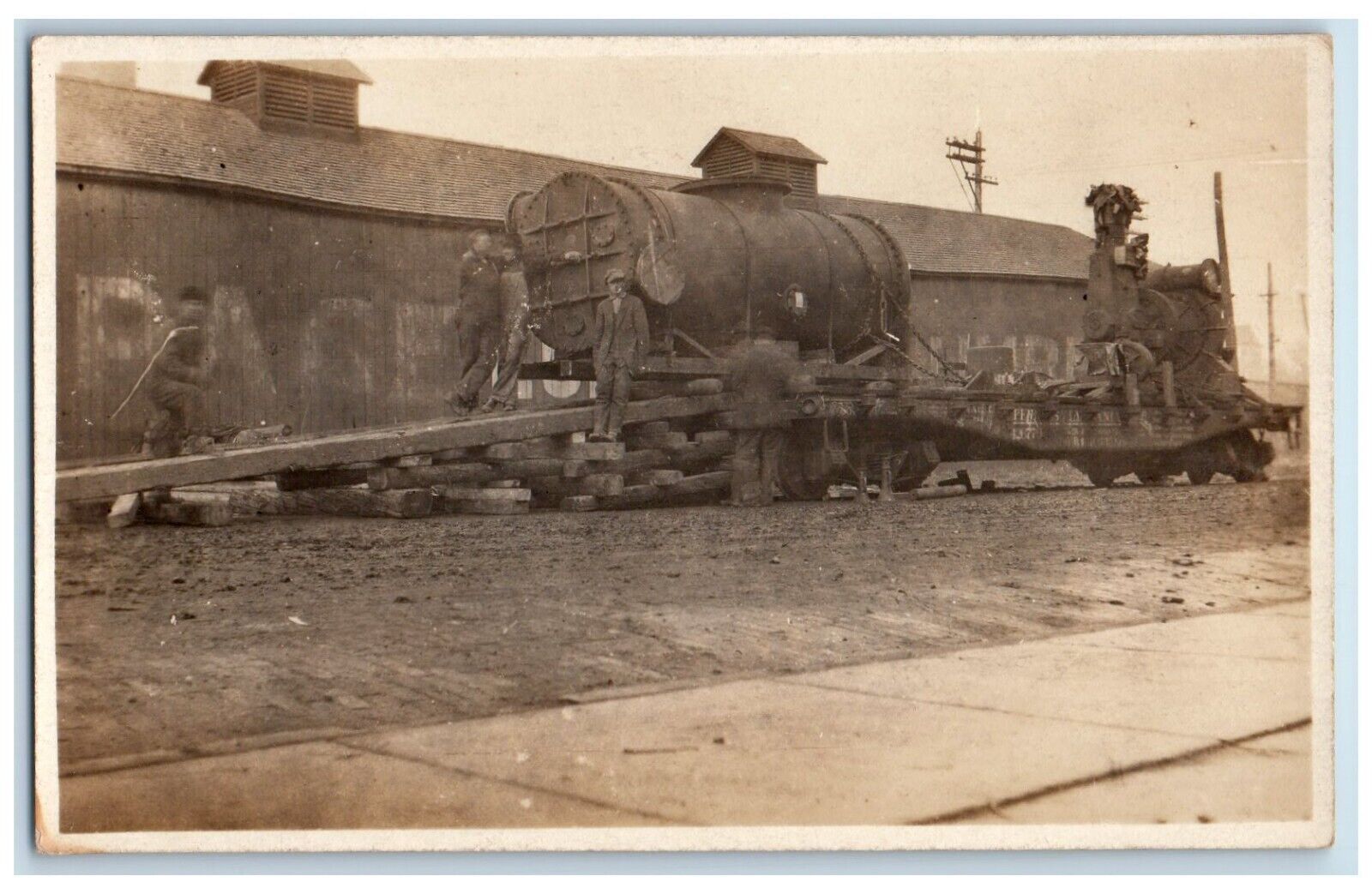 c1910's Railroad Workers Unloading Boiler Occupational RPPC Photo Postcard