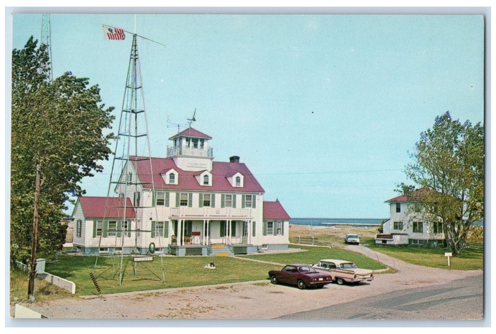 c1960s U.S. Coast Guard Station Grand Marais Michigan MI Unposted Cars Postcard