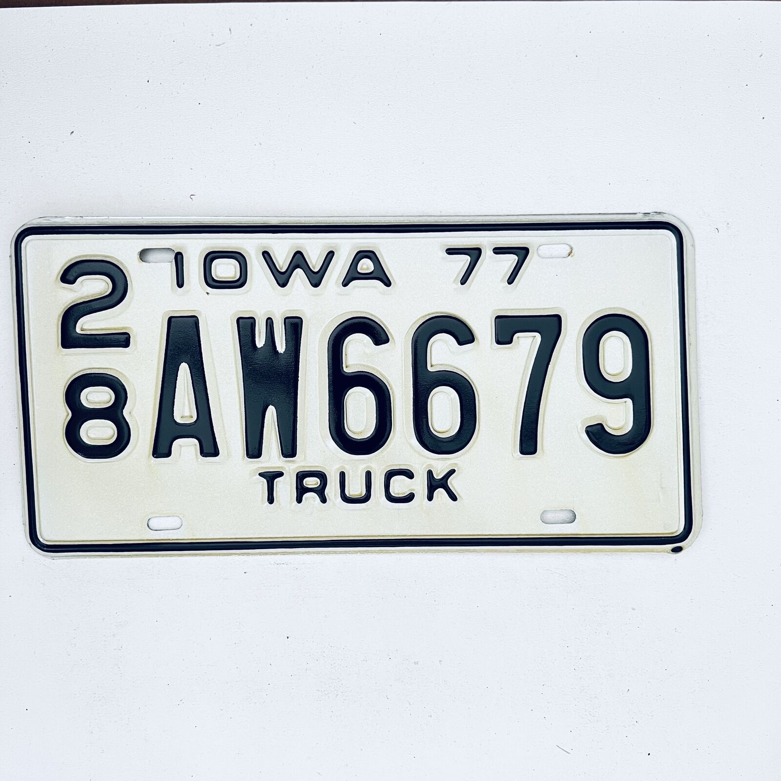 1977 United States Iowa Delaware County Passenger License Plate 28 AW6679