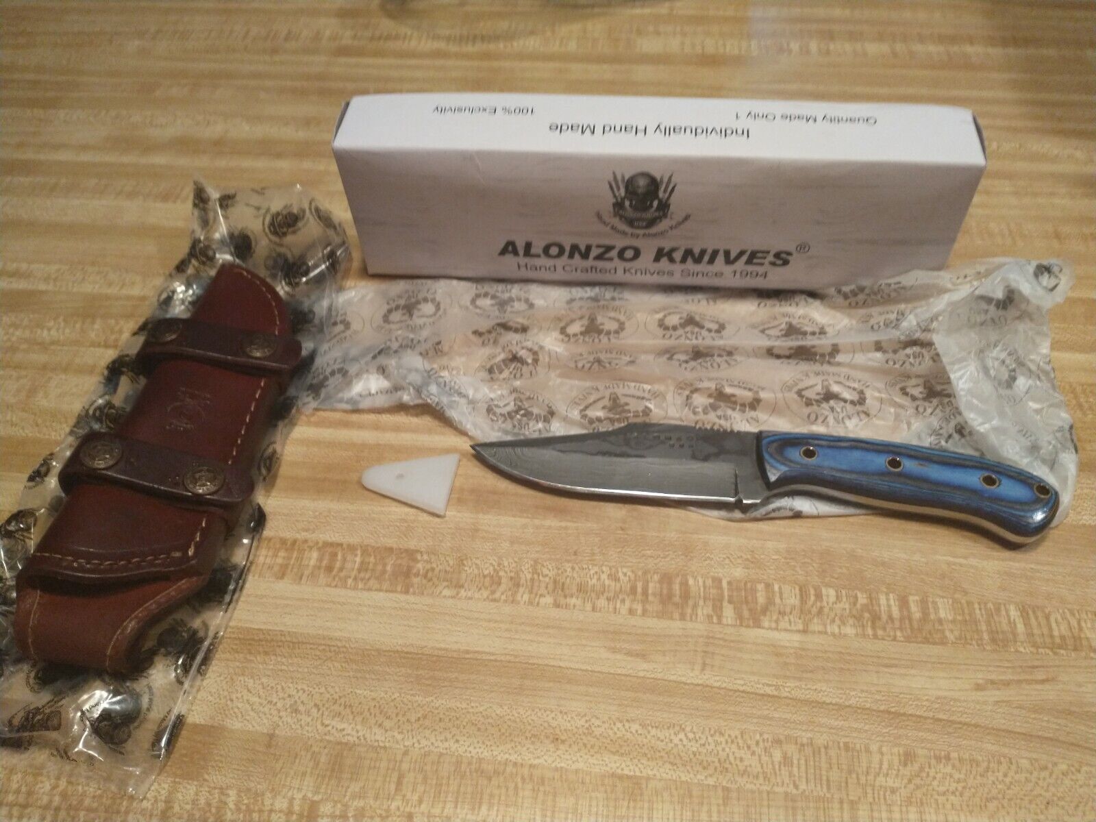 New Alonzo U.S.A Custom Hunting Knife With Leather Sheath And Blue Laminated.