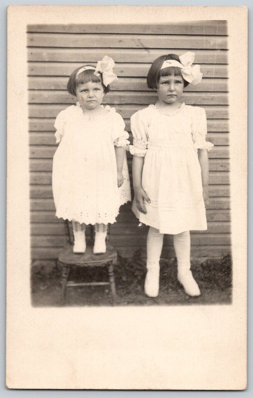 RPPC Postcard~ Two Unhappy Young Girls In White Dresses With Large Bows
