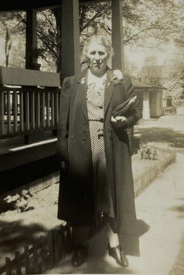 Older Woman With Carnation Standing By Porch Of House B&W Photograph 3 x 4.25