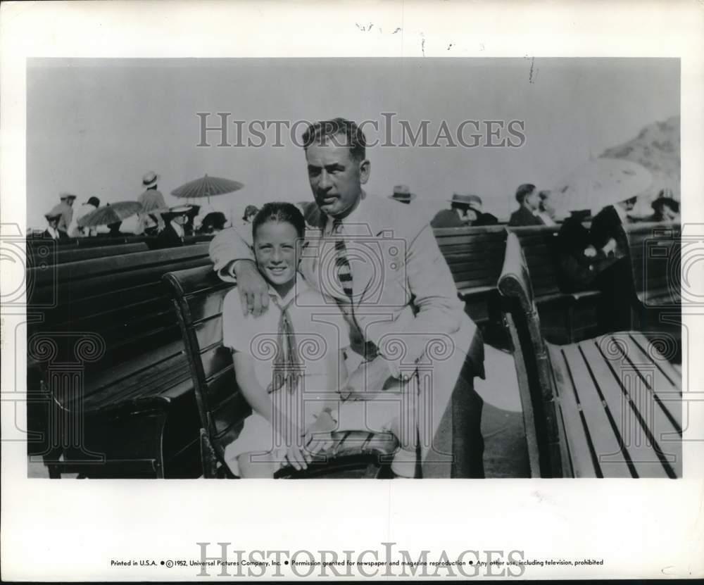1952 Press Photo Actor Gregory Peck seated with Child - hcq02953