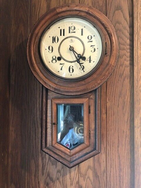 Antique wall-hung clock.  Wooden body, nice chime.  21\