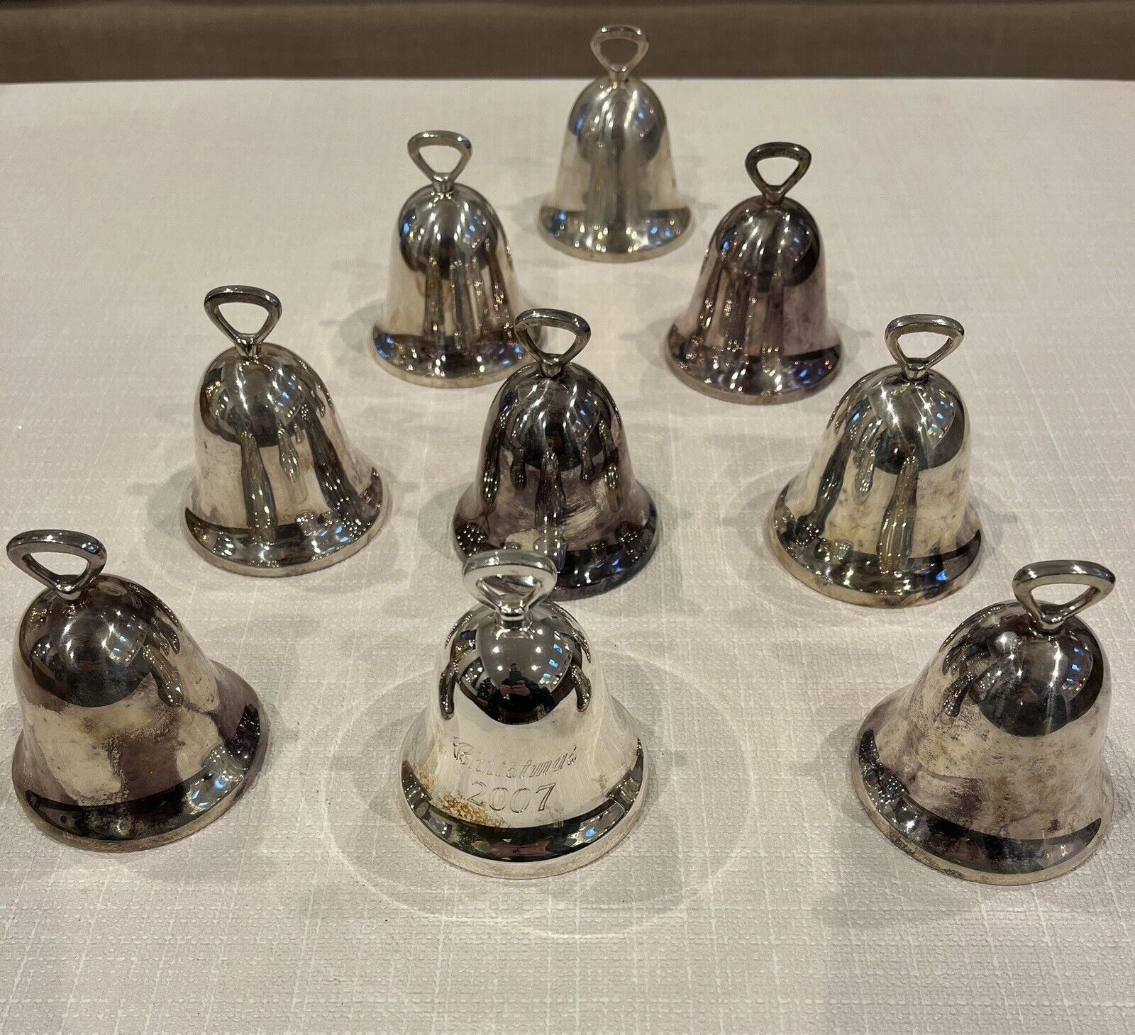Lot of 9 Reed and Barton silver bells.