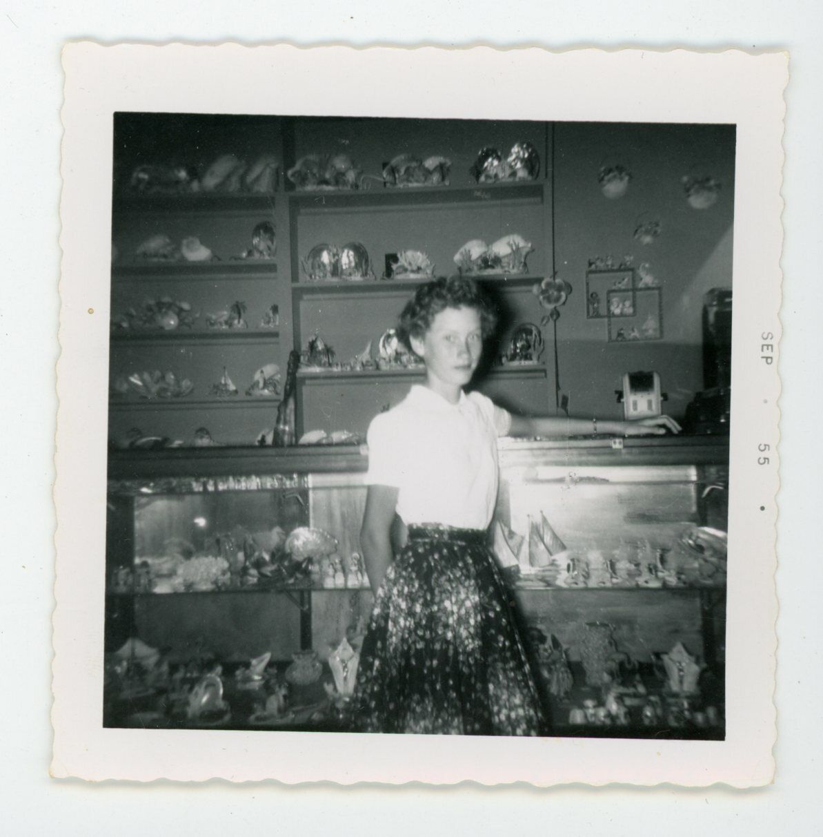 Attractive slender stylish woman in retail store   Vintage found snapshot Photo