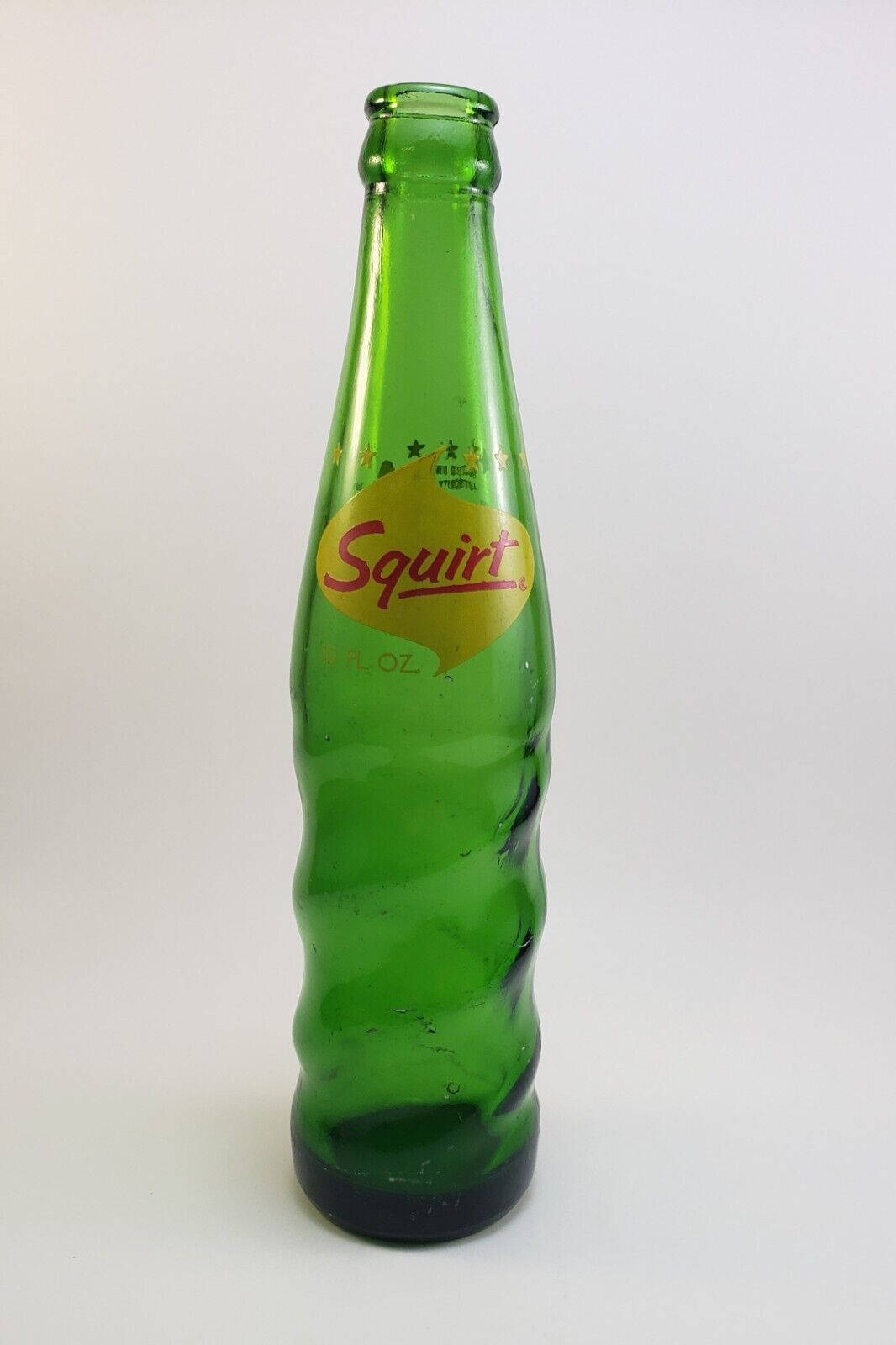 Vintage Squirt 10oz Twisted Soda Pop Bottle Green Glass w/Lil Squirt Mascot