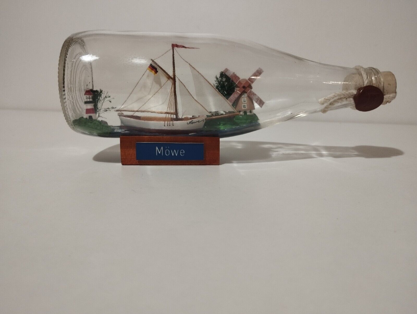 🟢Mauvais in a Bottle Ship Germany Wooden stand, good condition.🟢 Over 8 inches