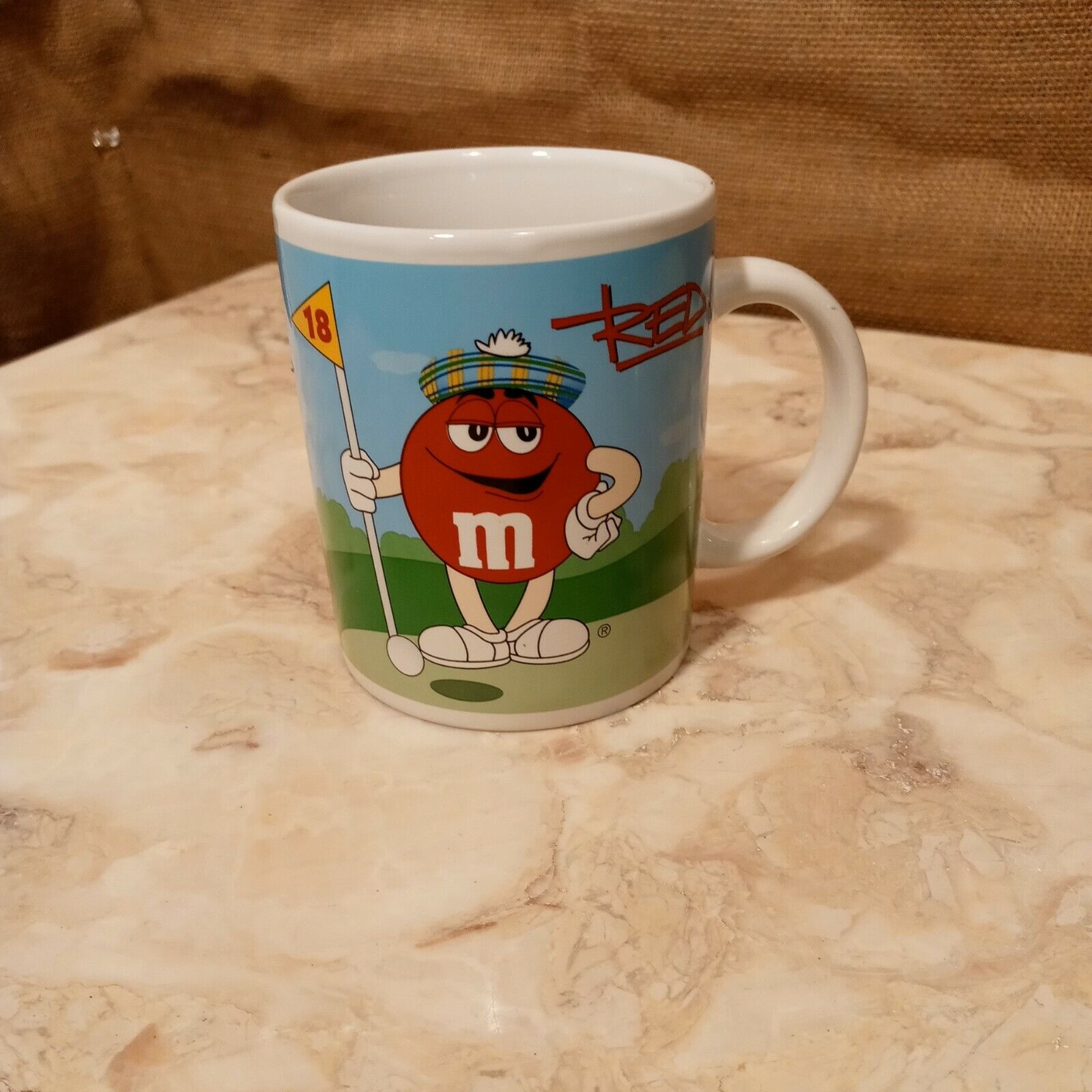 2002 Galerie M&M Golfing Coffee Mug (Red and Blue)