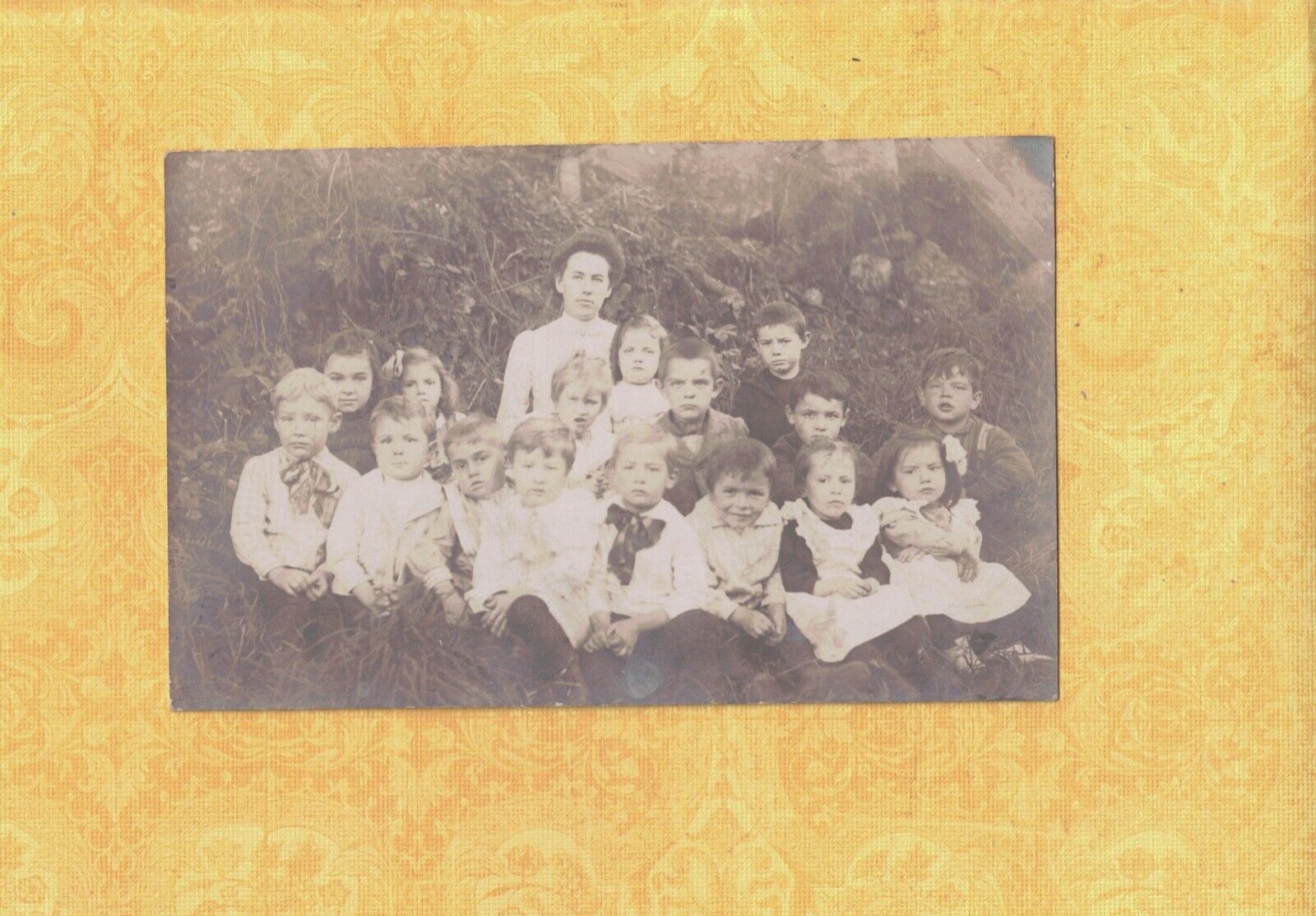 X RPPC real photo postcard TEACHER WITH HER YOUNGER STUDENTS ? GROUP PHOTO 