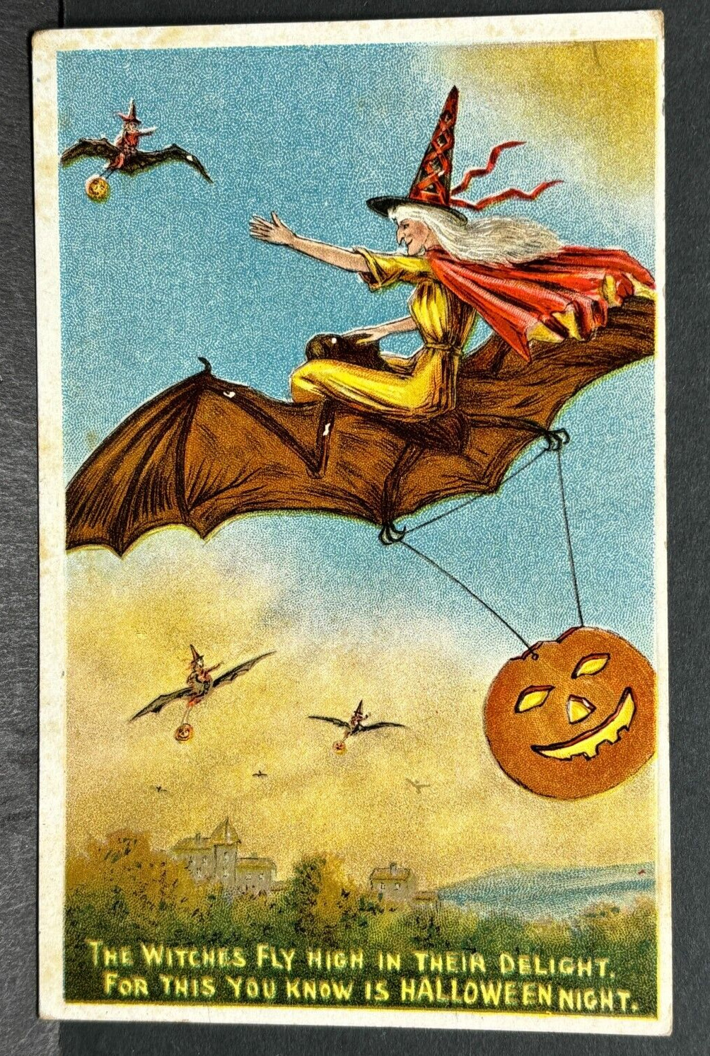 1910 Embossed Postcard Witches on Bats Flying Over Town Happy Halloween Night