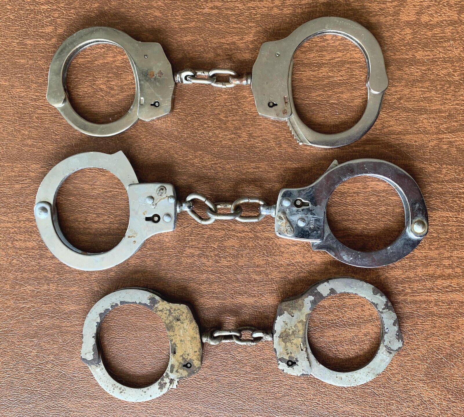 3 sets of real, genuine, authentic handcuffs, of unknown origin, unknown history