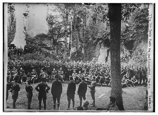 77th Division Band plays,General Alexander,instruments,troops,soldiers,France