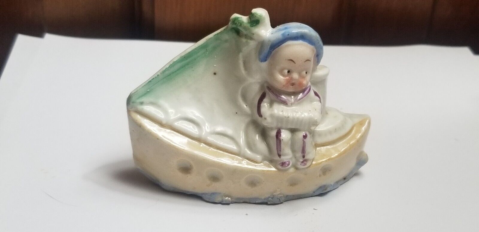Antique German miniature porcelain figurine googly eye boy in boat
