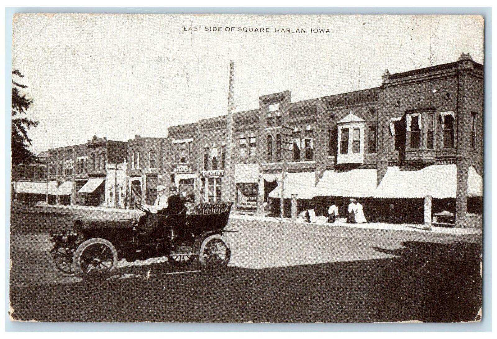 1909 East Side Of Square Shops And Car Scene Harlan Iowa IA Unposted Postcard