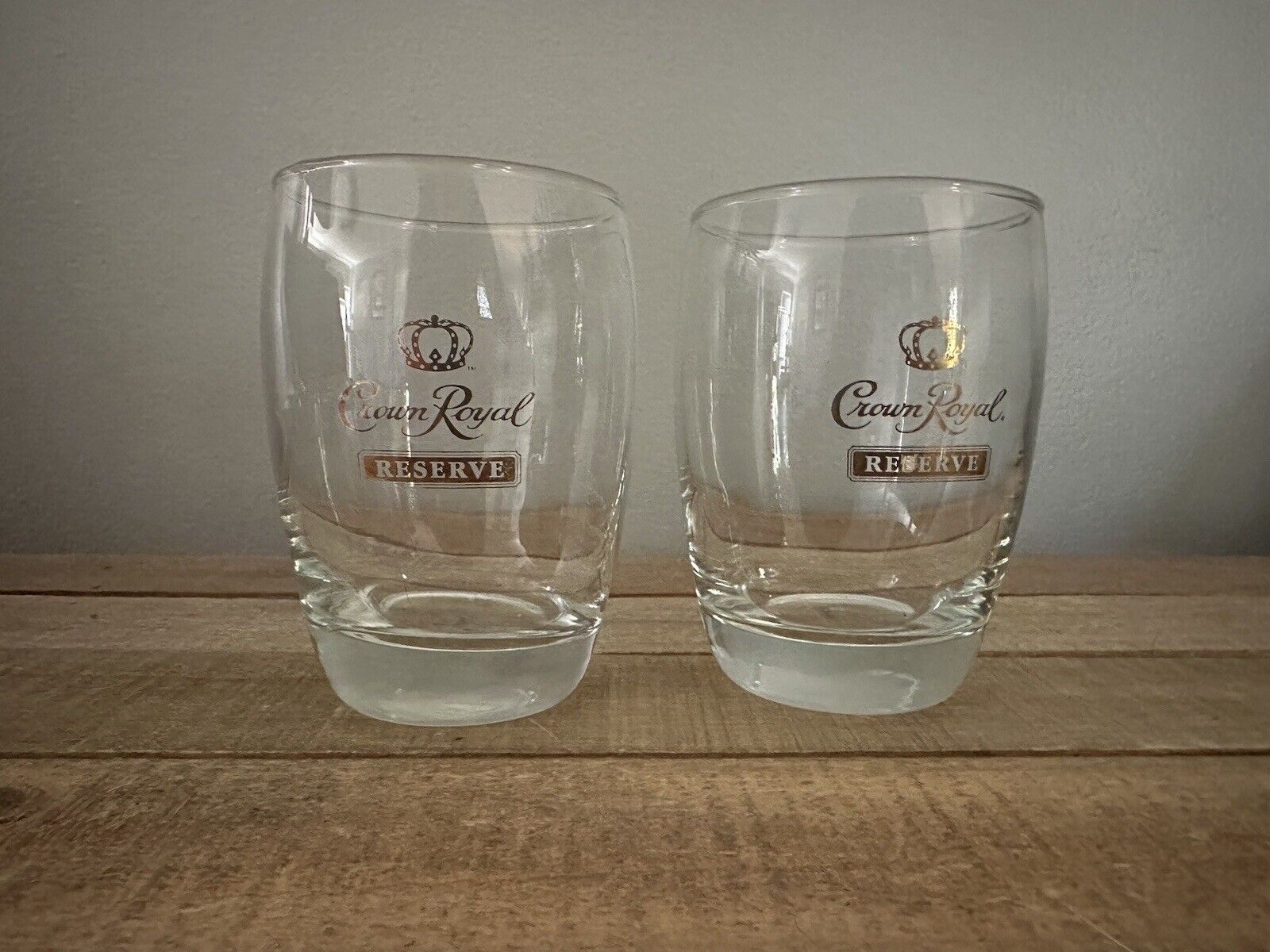 PAIR OF CROWN ROYAL RESERVE WHISKEY GLASSES WITH GOLD LETTERING AND LOGE