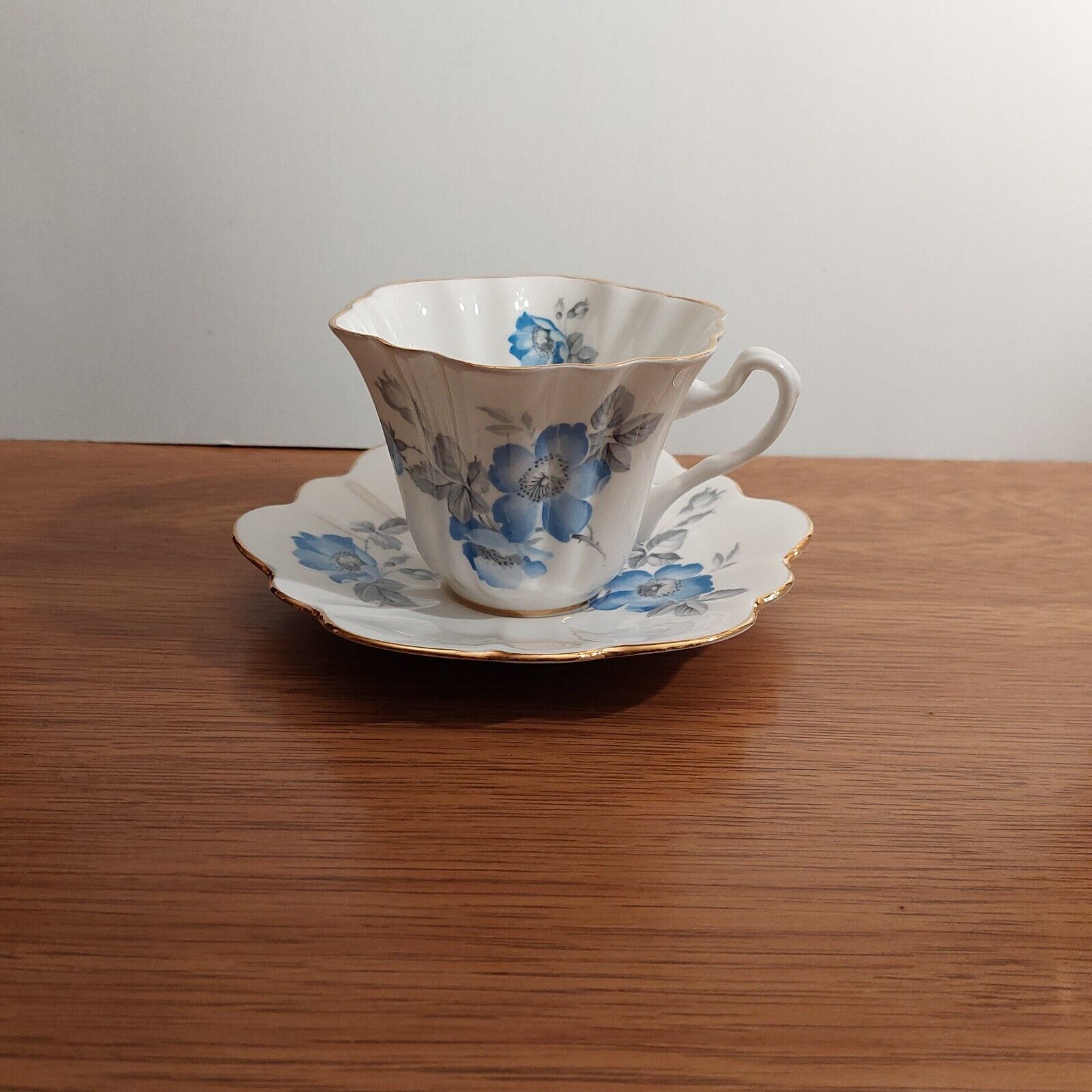 Vintage Crown Mark bone china Cup & Saucer made in England with Blue Rosehip
