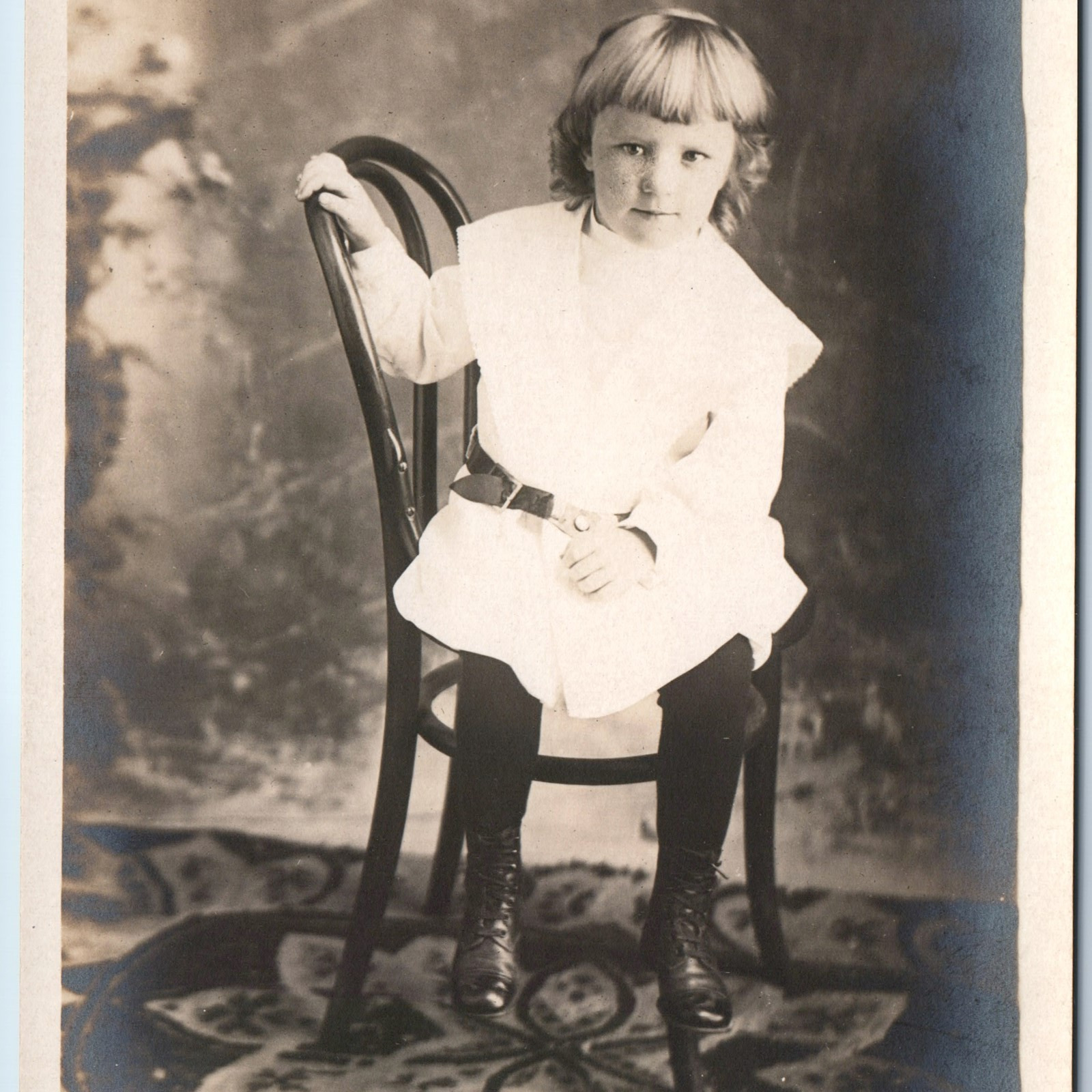 c1910s Little Girl Portrait RPPC Bangs Chair Rug Cute Young Lady Real Photo A260