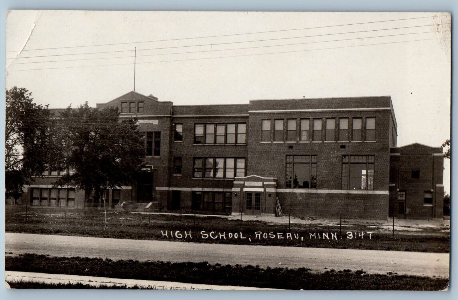Roseau Minnesota MN Postcard RPPC Photo High School Building Scene Street c1910s