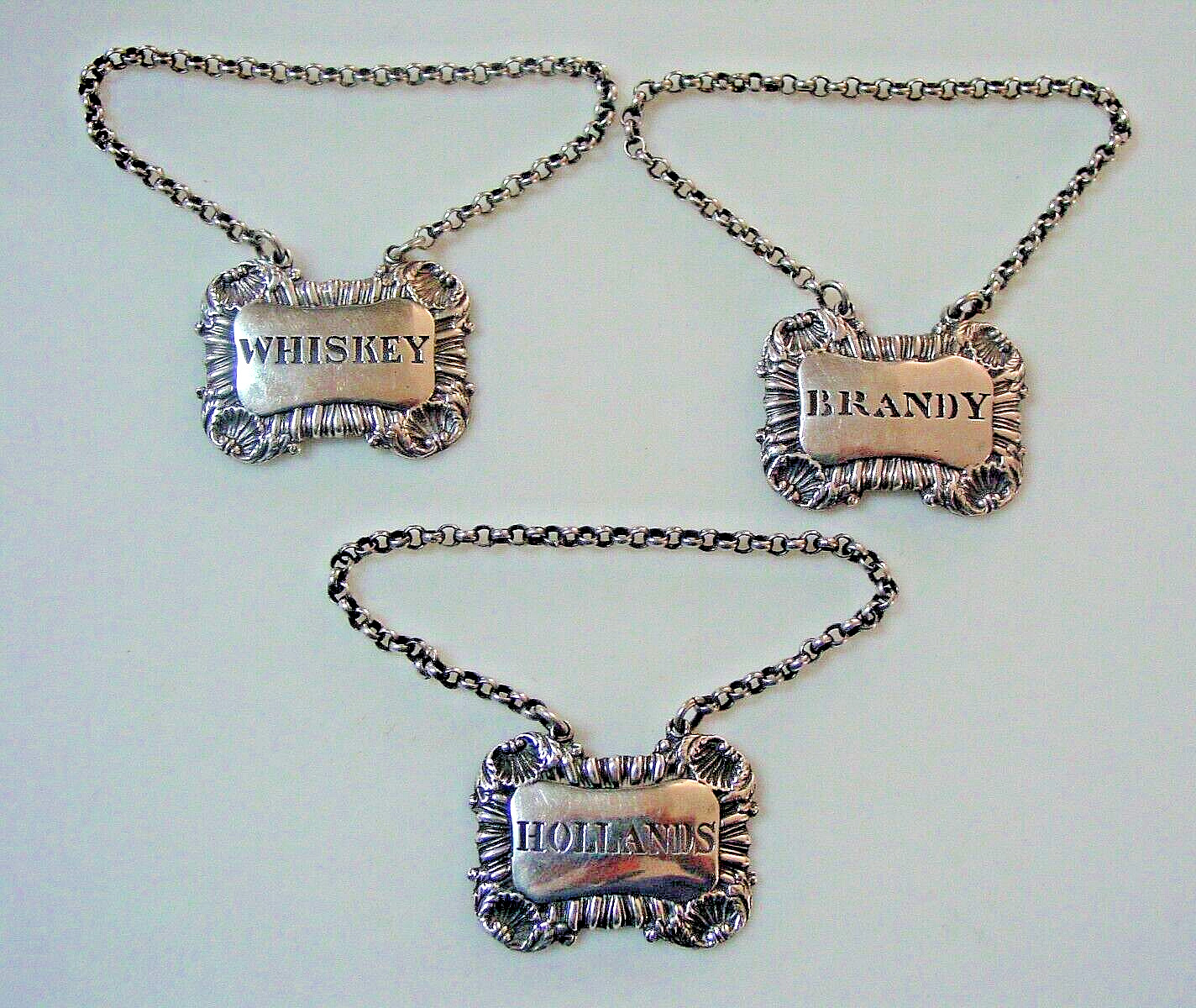 Fine quality, hefty sterling silver decanter labels HOLLANDS, WHISKEY, BRANDY.