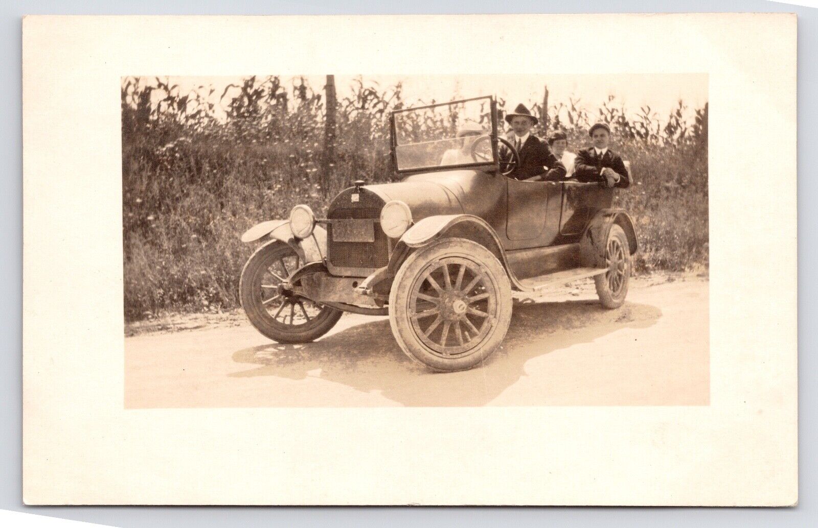 c1915~Family Riding in Model T near Cornfields~Delaware Ohio OH~RPPC Postcard