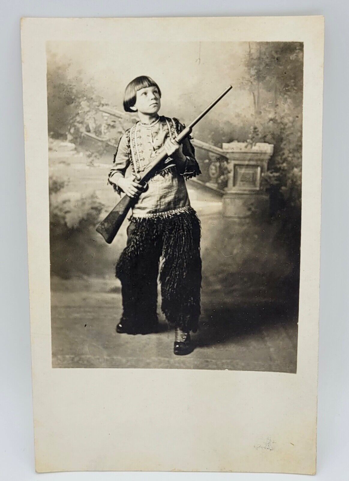 RPPC~Boy Holding Rifle Decked Out in Wooly Chaps & Western Wear~Staged Photo