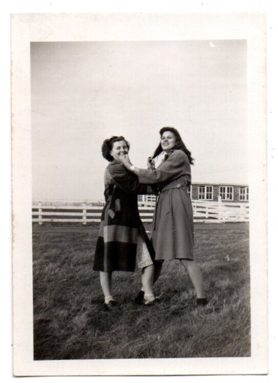 Two Nicely Dressed Women Woman Fish To Chin Pulling Hair Unusual Snapshot Photo