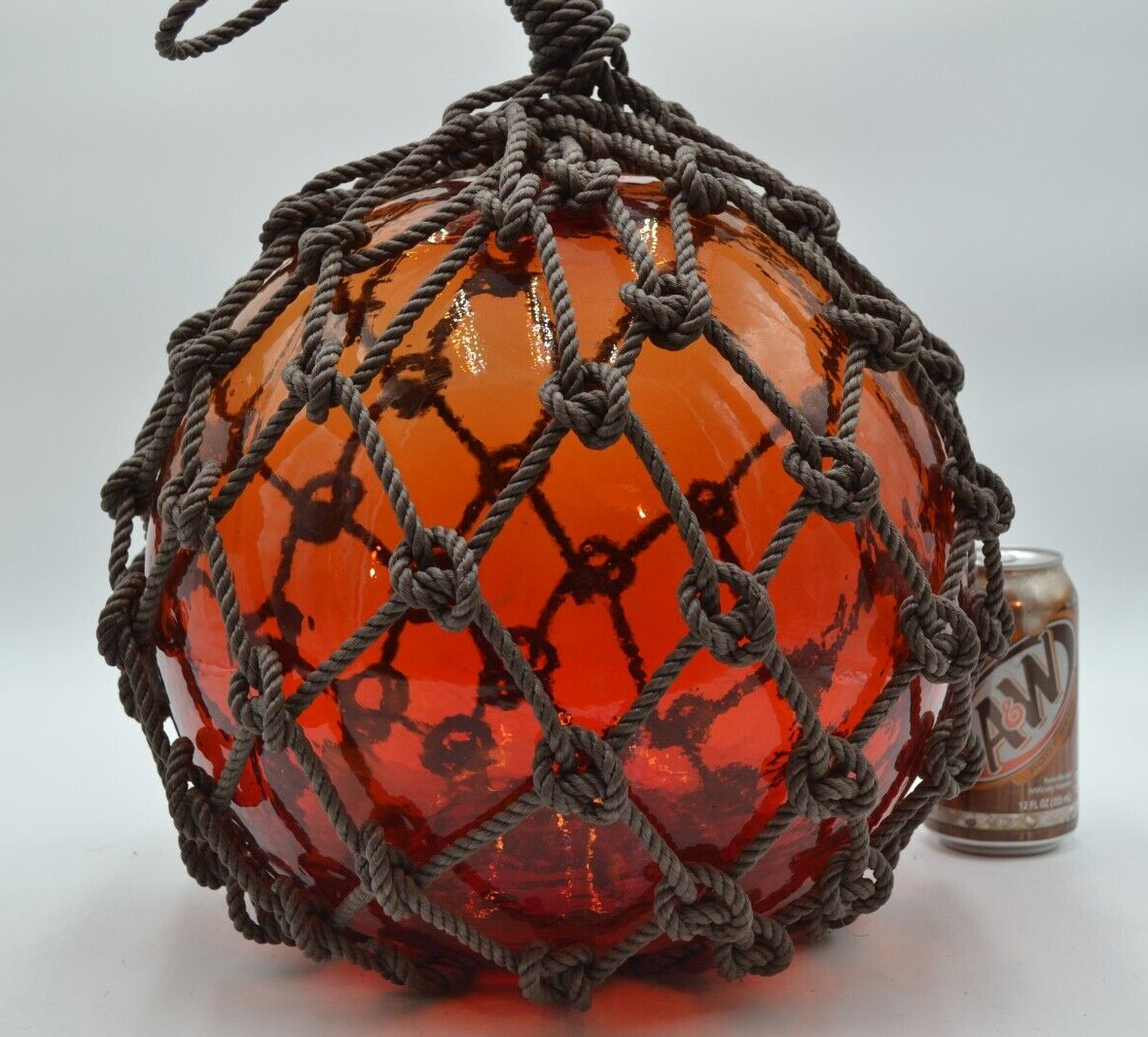 VINTAGE GLASS FISHING FLOAT IN RED AMBER
