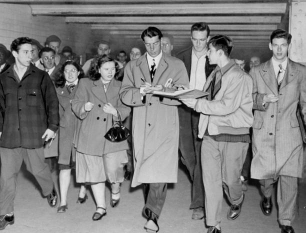 The Yanks ARE IN Joe DiMaggio signs autographs for fans who met hi .. Old Photo