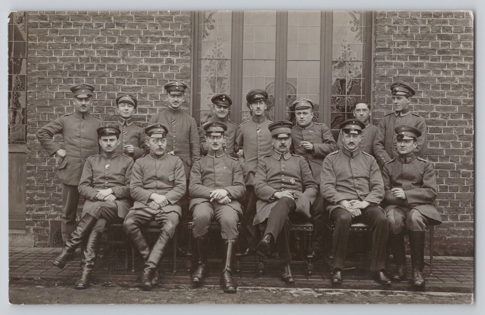 WWI RPPC German Soldiers Group Portrait Outdoors Old Brick Building Postcard