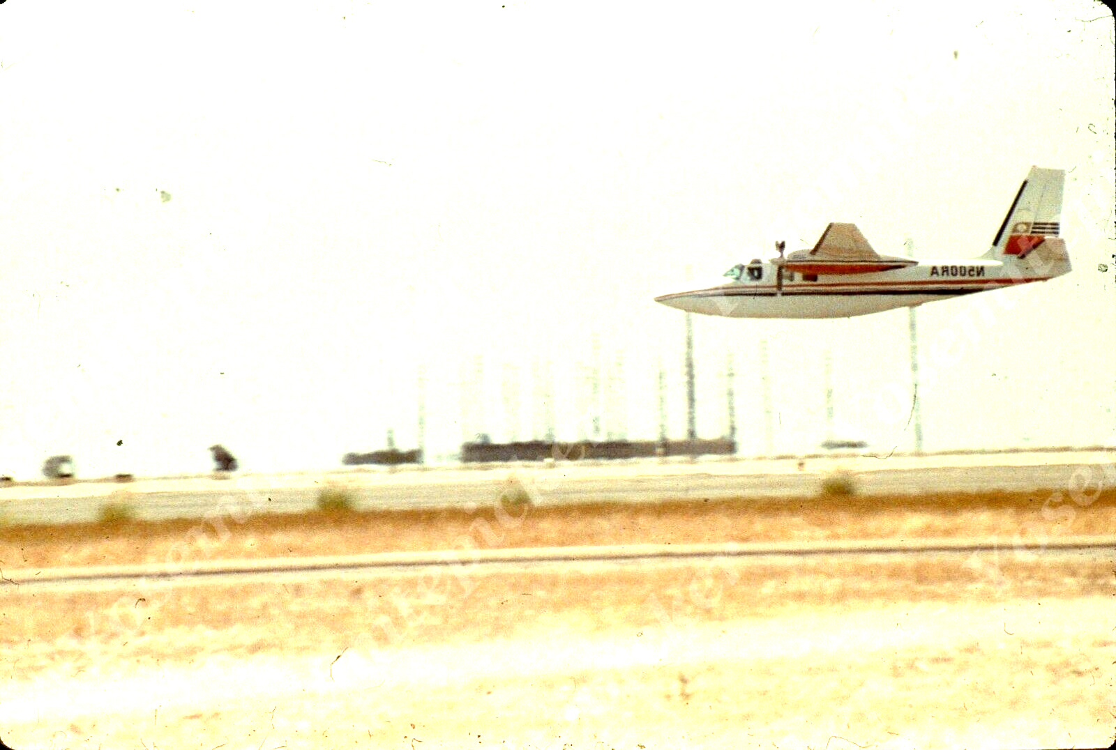 sl46  Original Slide 1983 small airplane landing 129a