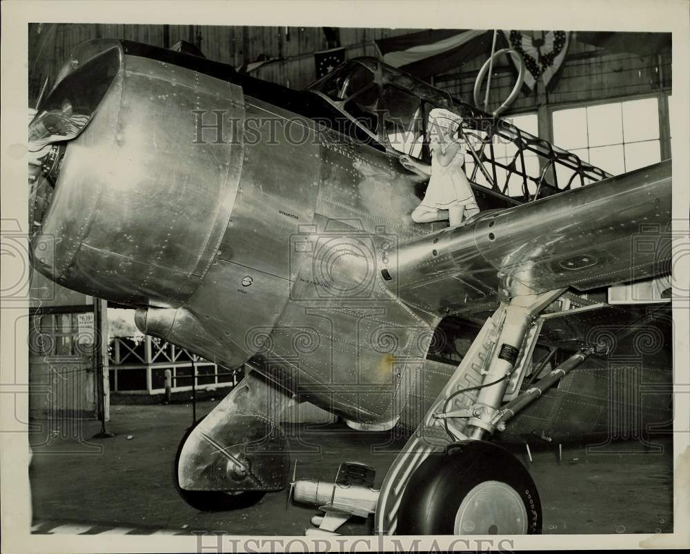 1938 Press Photo Ann Johnson on 109th Air Squad Observation Plane in Hangar