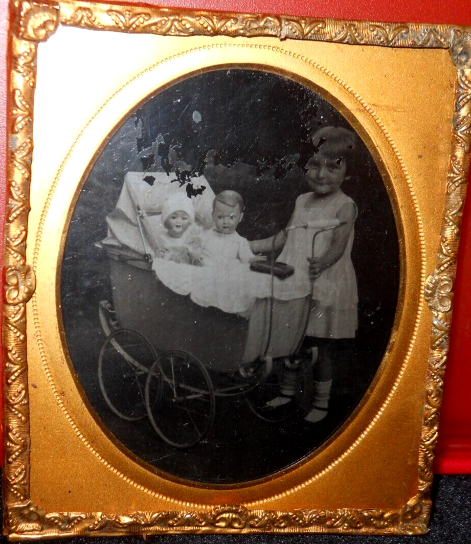 1/6th size Tintype of girl with dolls in brass mat/frame