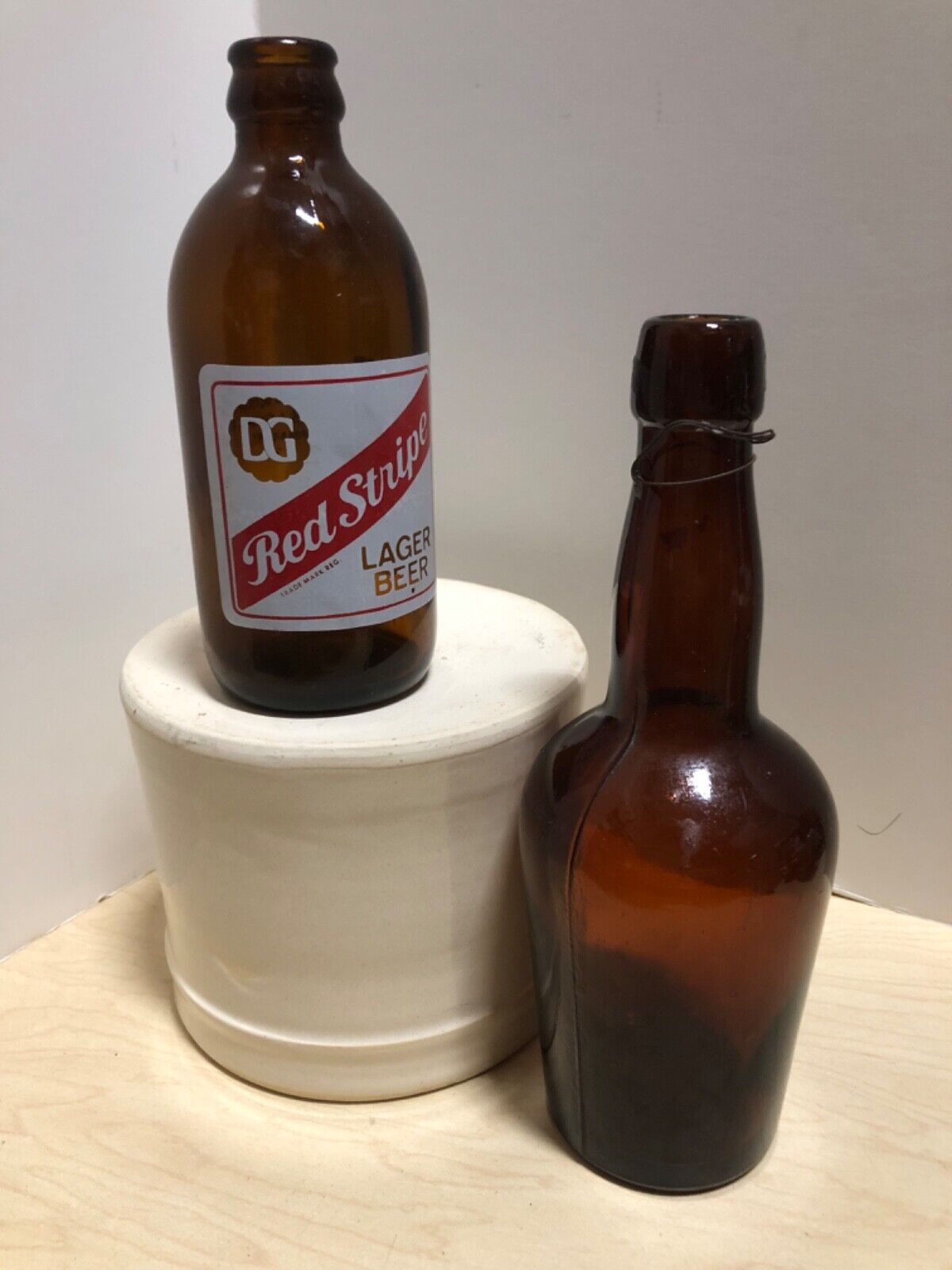 pabst malt extract bottle and red stripe lager beer bottle
