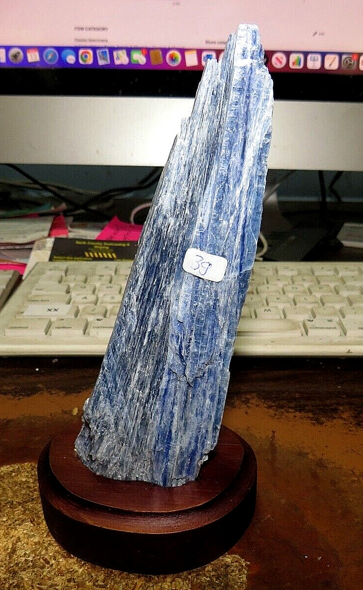 GORGEOUS TALL SPECIMEN OF BLUE KYANITE IN A WOOD STAND