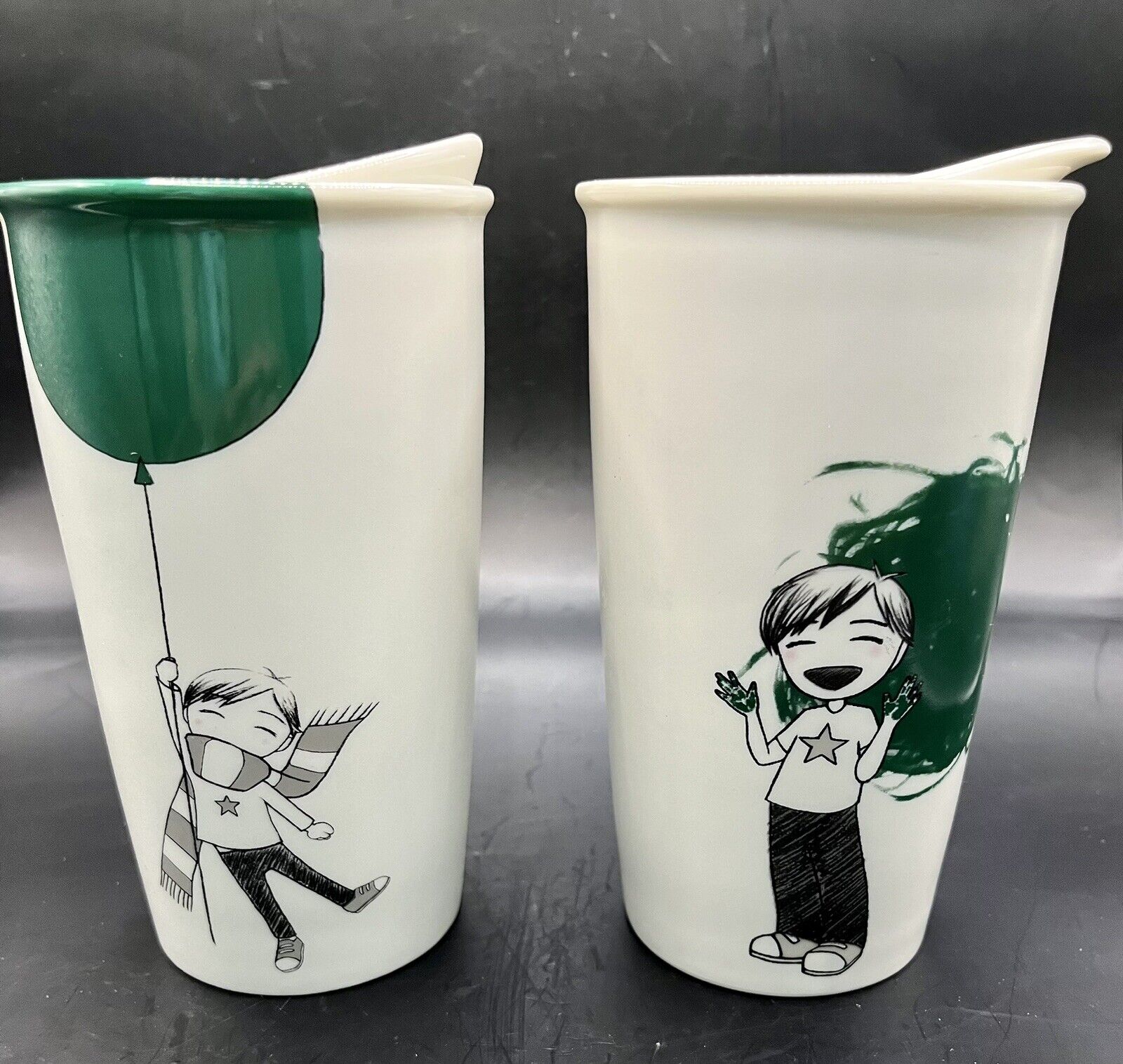 Two (2) Starbucks ceramic travel mugs, Boy w/ Green Balloon & Boy Painter