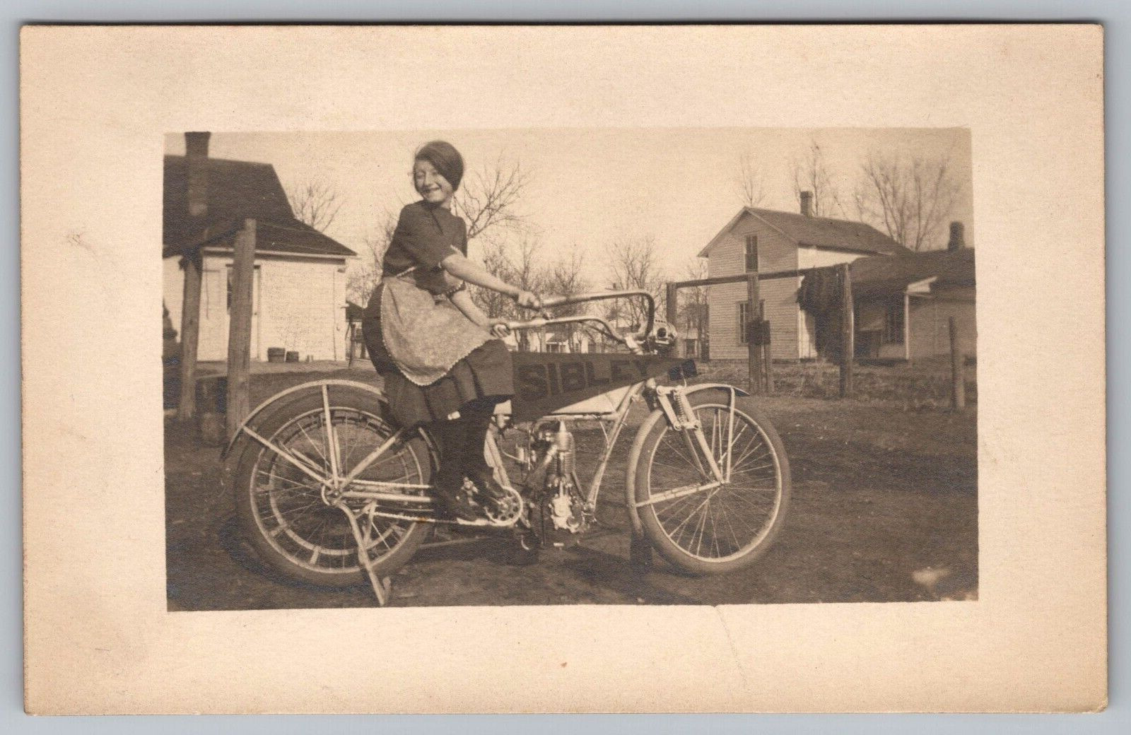 RPPC Pretty Woman Sitting on Motorcycle Bike Sibley Banner Postcard