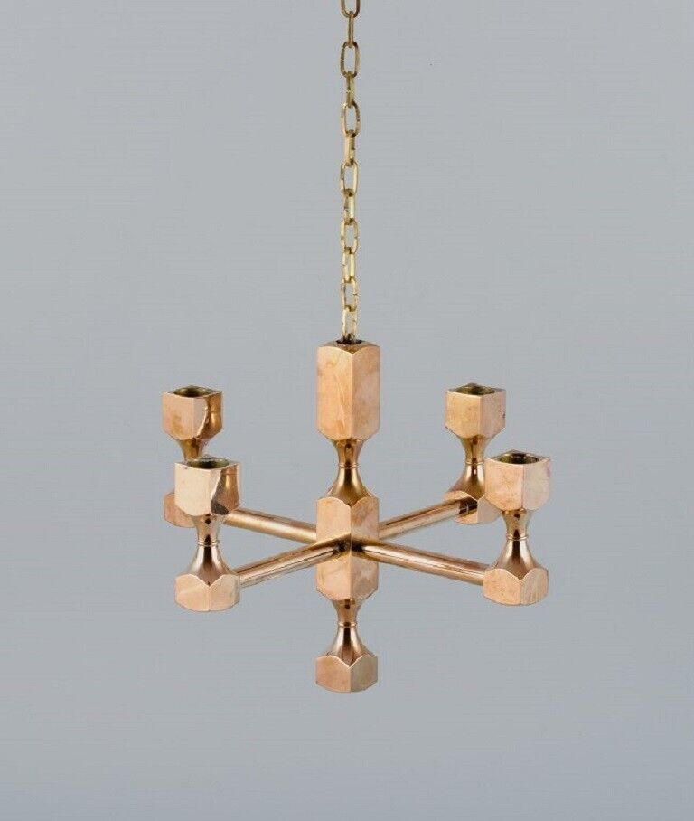 Gusum Metall, Sweden. Chandelier in solid brass for four candles.