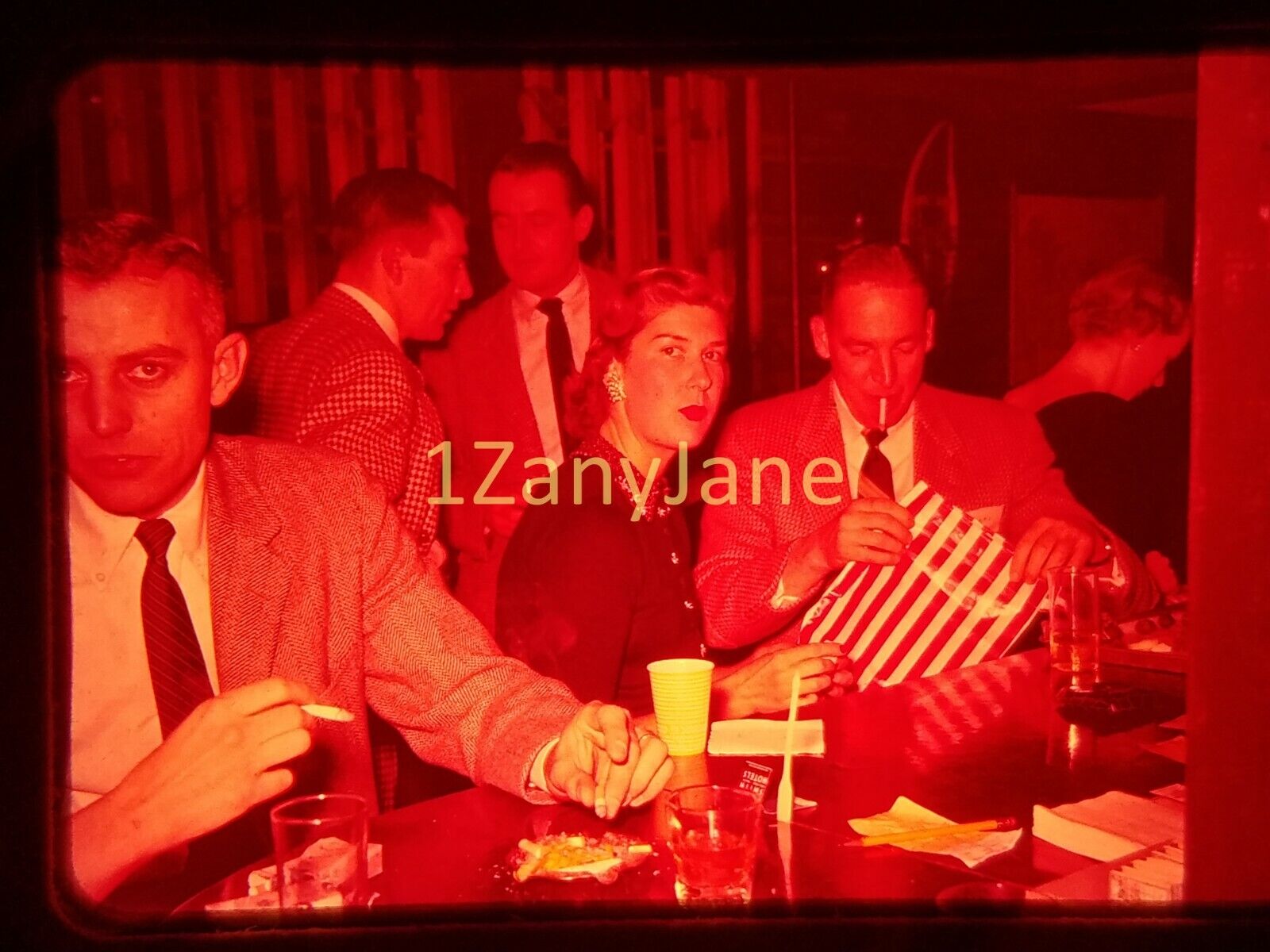 XXPO04 Vintage 35MM SLIDE Photo MAN OPENS PRESENT AT BAR DURING PARTY