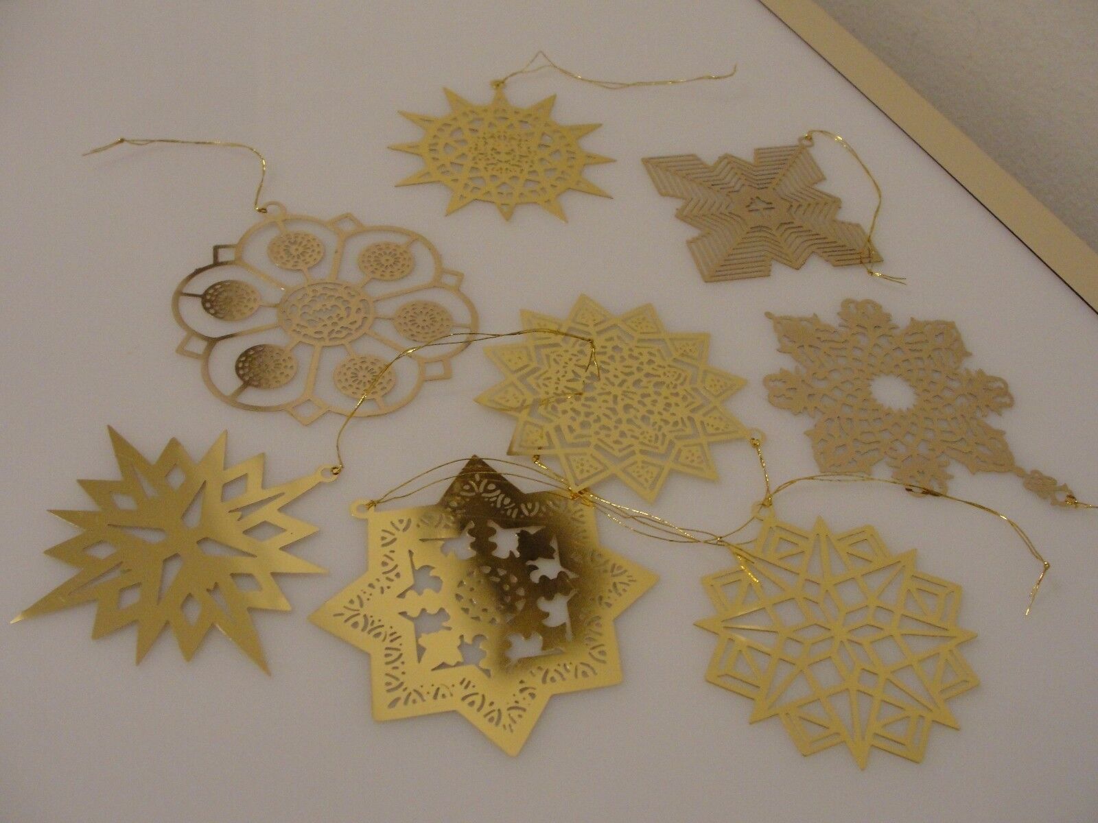 8 Unicef gold-plated Holiday stars and/or snowflakes Christmas ornaments