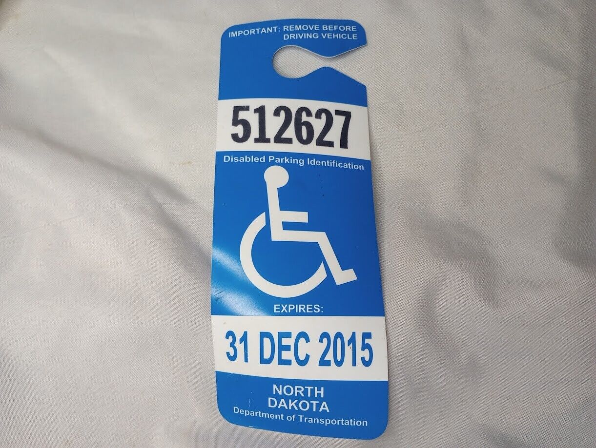 ---2015 expired North Dakota disabled parking mirror hanging permit
