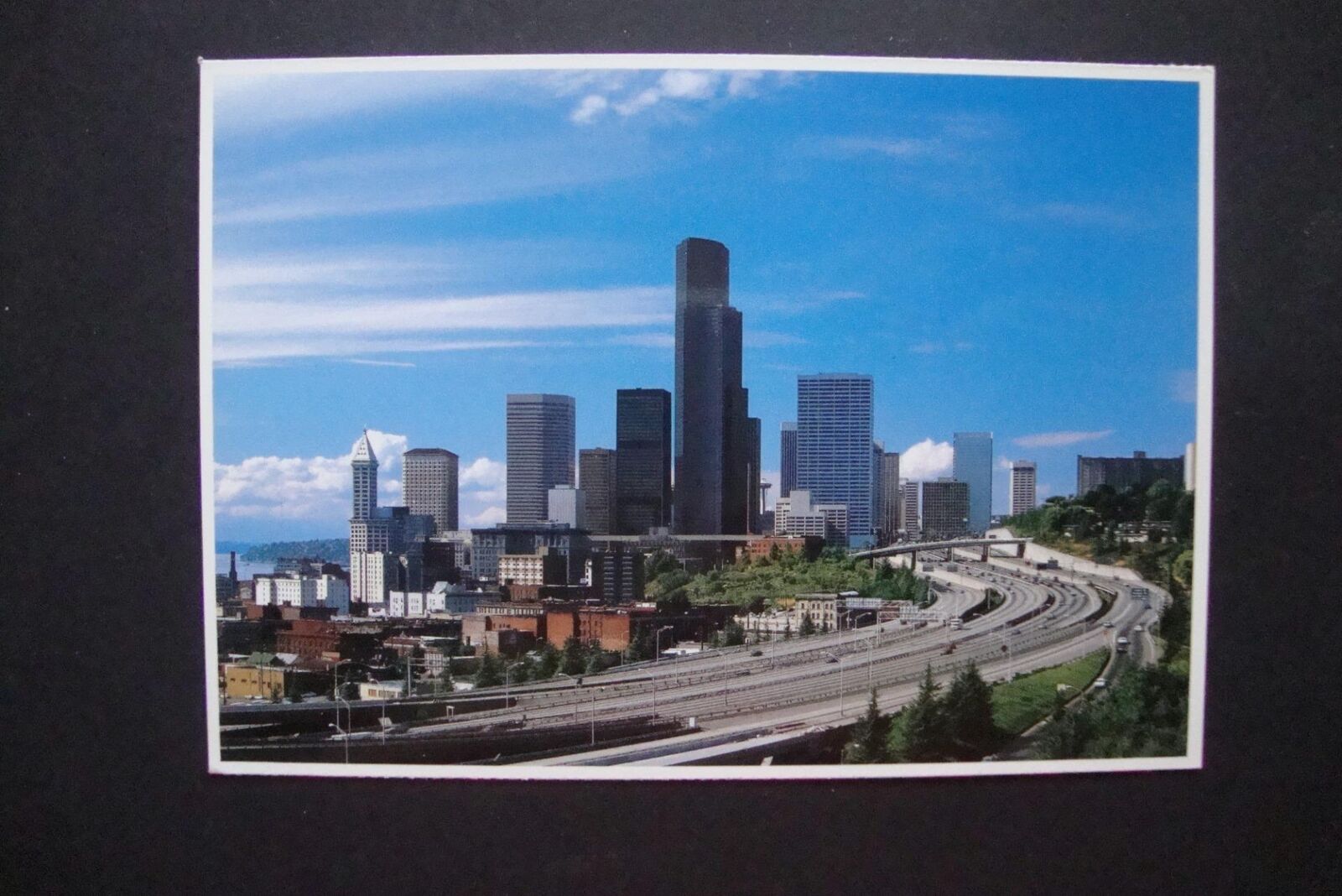 Railfans2 470) 1986 Postcard, Seattle Washington Skyscrapers, Interstate Highway