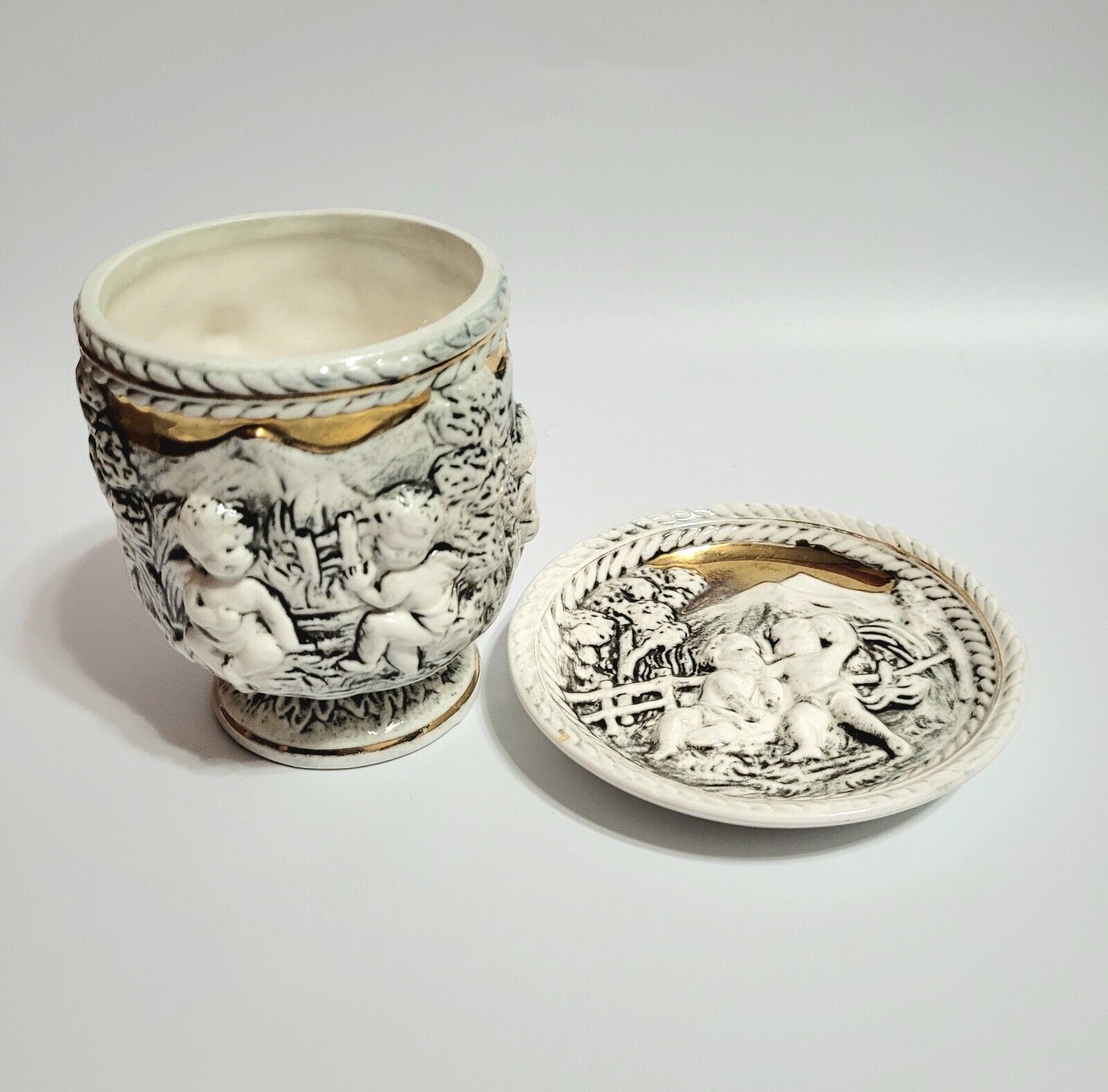 Vtge Porcelain Demitasse Cup & Saucer Renaissance Cherubs Landscape Relief 