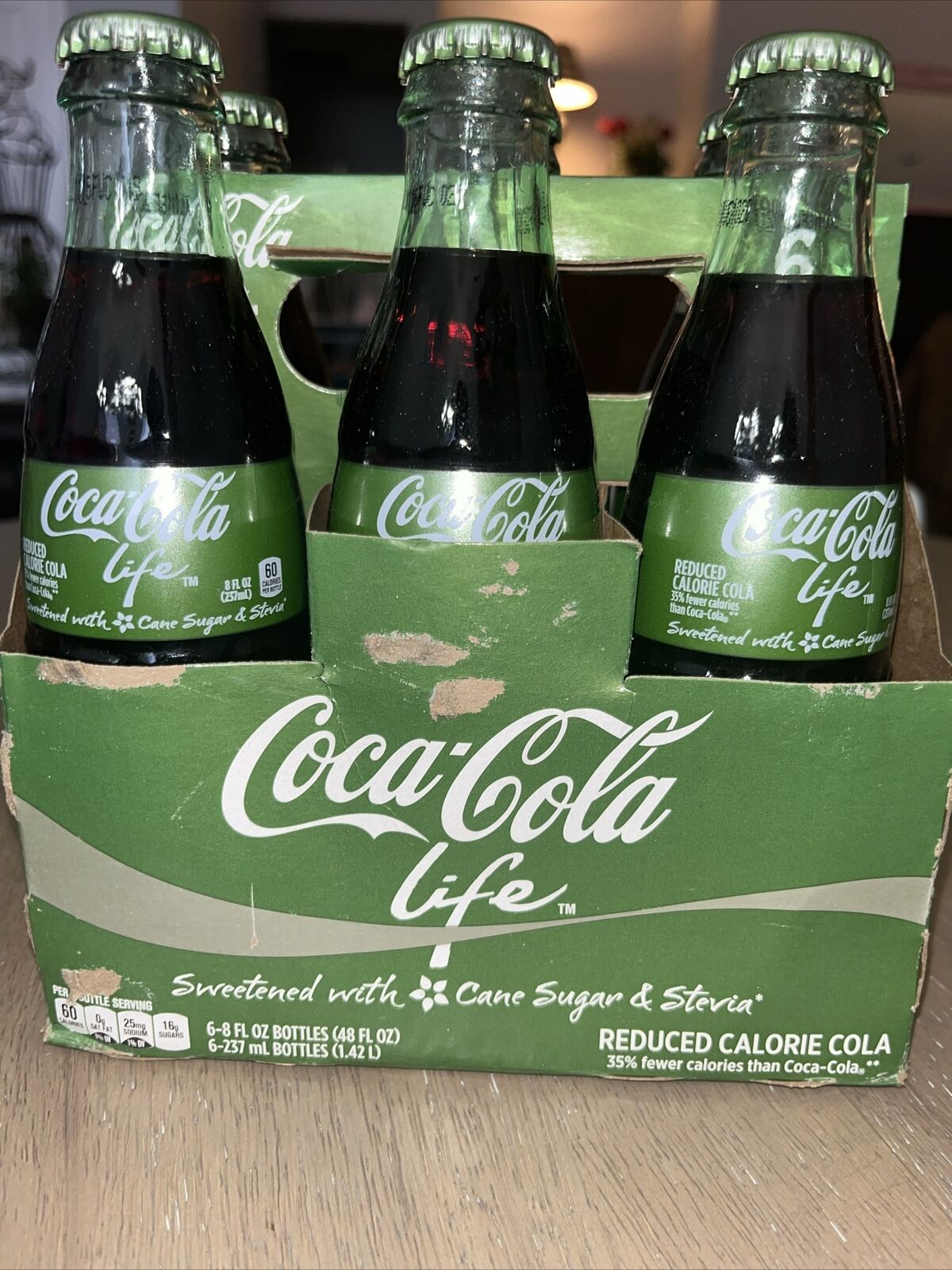 Coca Cola Life Reduced Calorie  6-8 FL Oz Glass Bottle Cane Sugar and Stevia