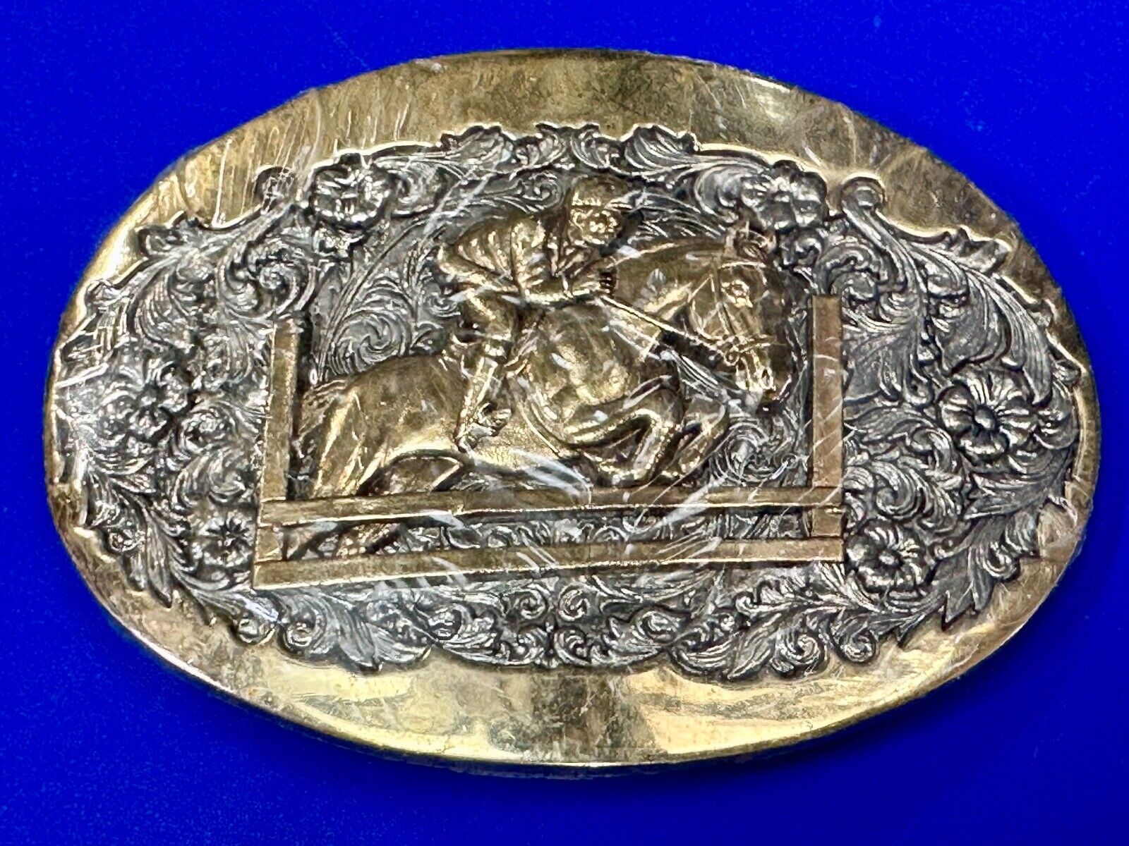 NOS 24k gold plated western cowboy jumping over fence ADM belt buckle in wrap