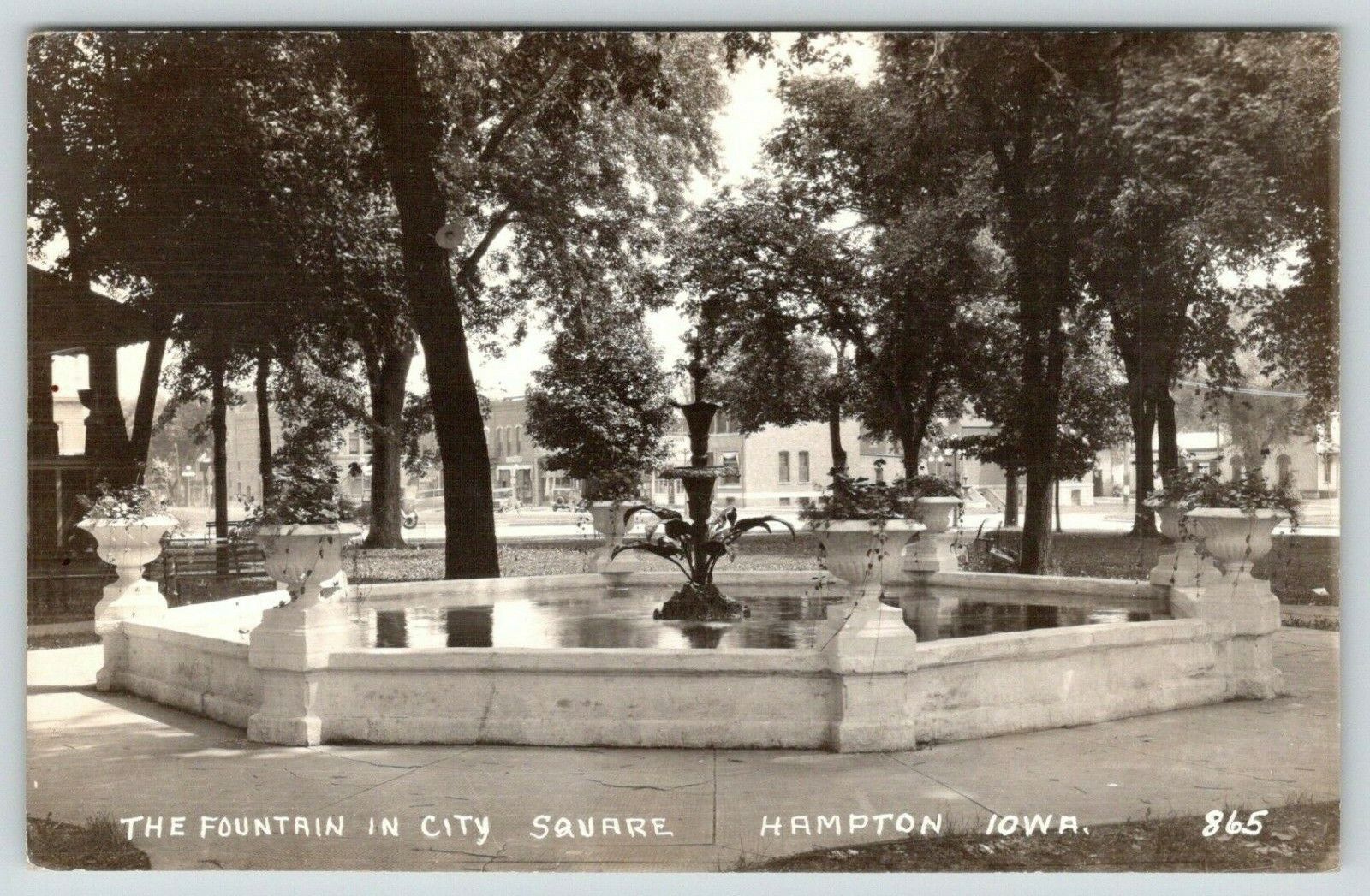 Hampton Iowa~City Square Fountain~Flower Urns~Storefronts Behind~1941 RPPC